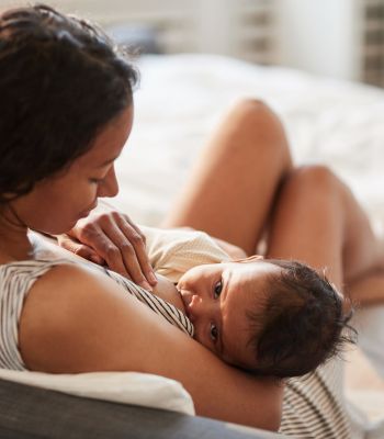 woman breastfeeding baby