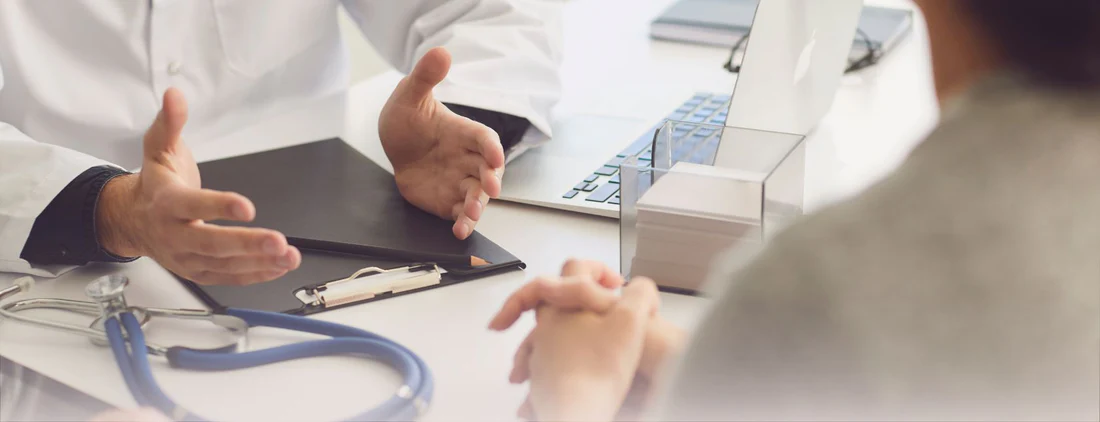doctor talking to patient