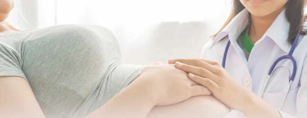 pregnant woman with doctor